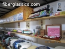 2019 36' Outboard, model boat, oil can and fishing display